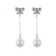 Crystal Bow and Pearl Drop Swingy Statement Earrings