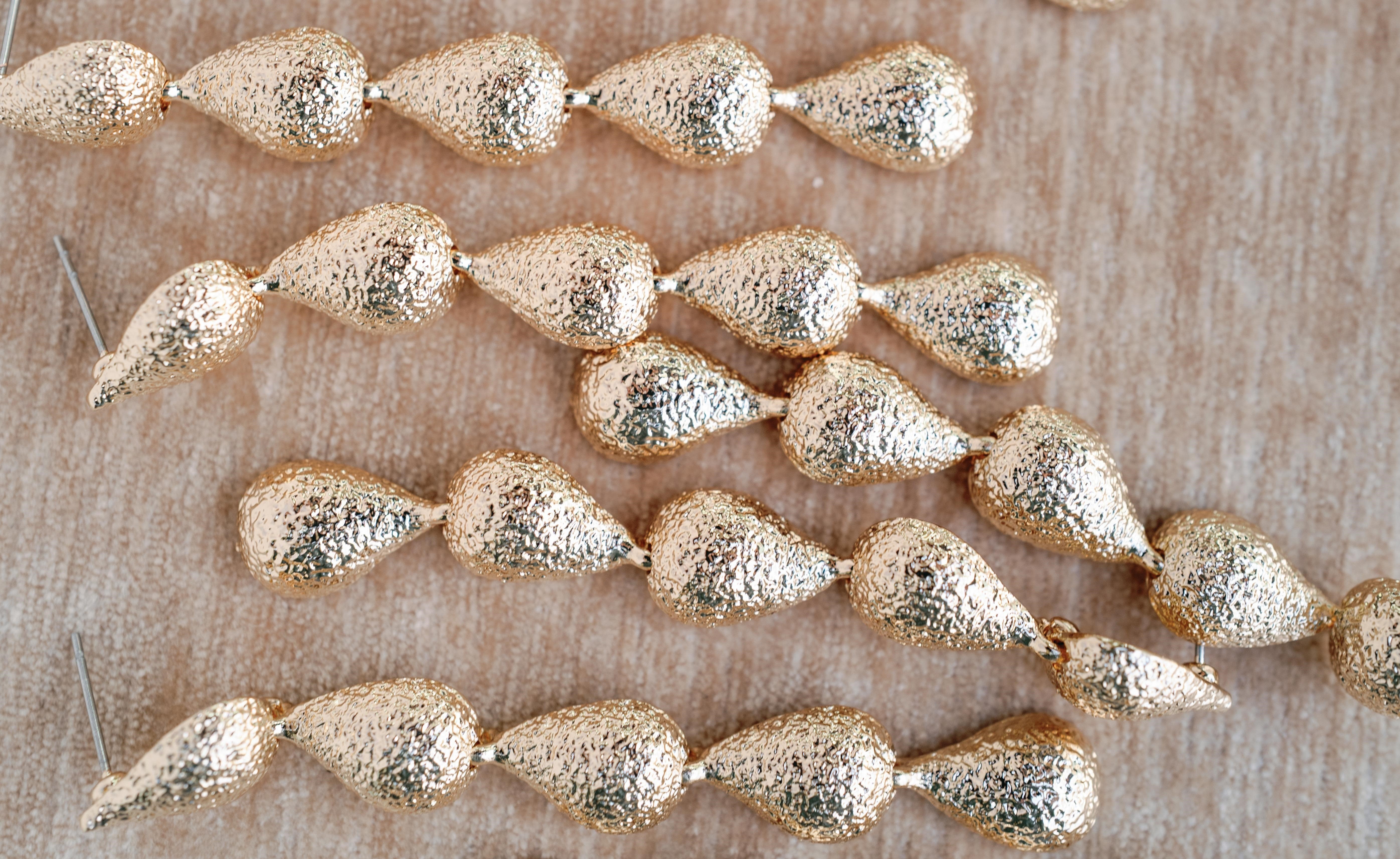 Swingy Textured Gold Teardrop Cascade Statement Earrings